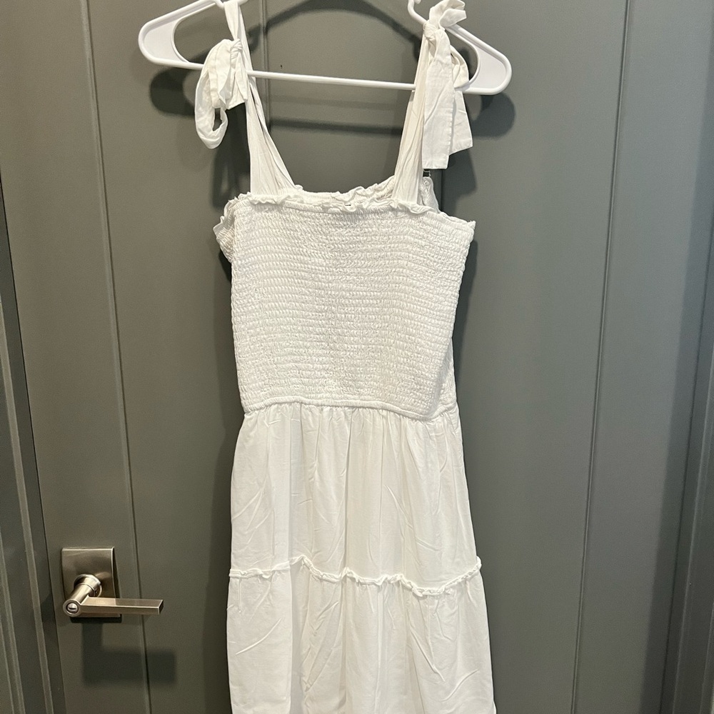 BRIDES! Never worn. Adorable white dress with ties in shoulder.